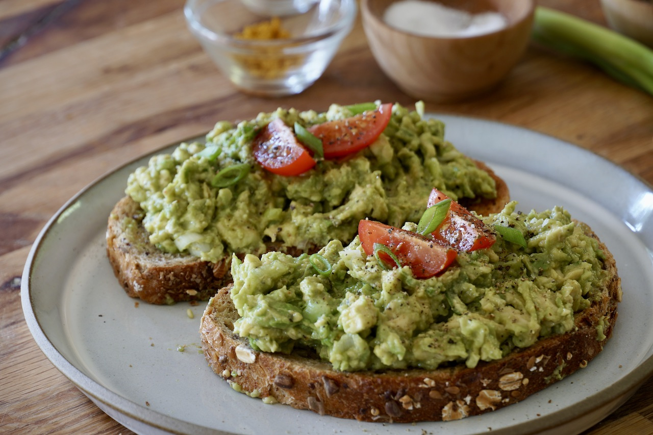 pureed avocado on toast with tomatoes