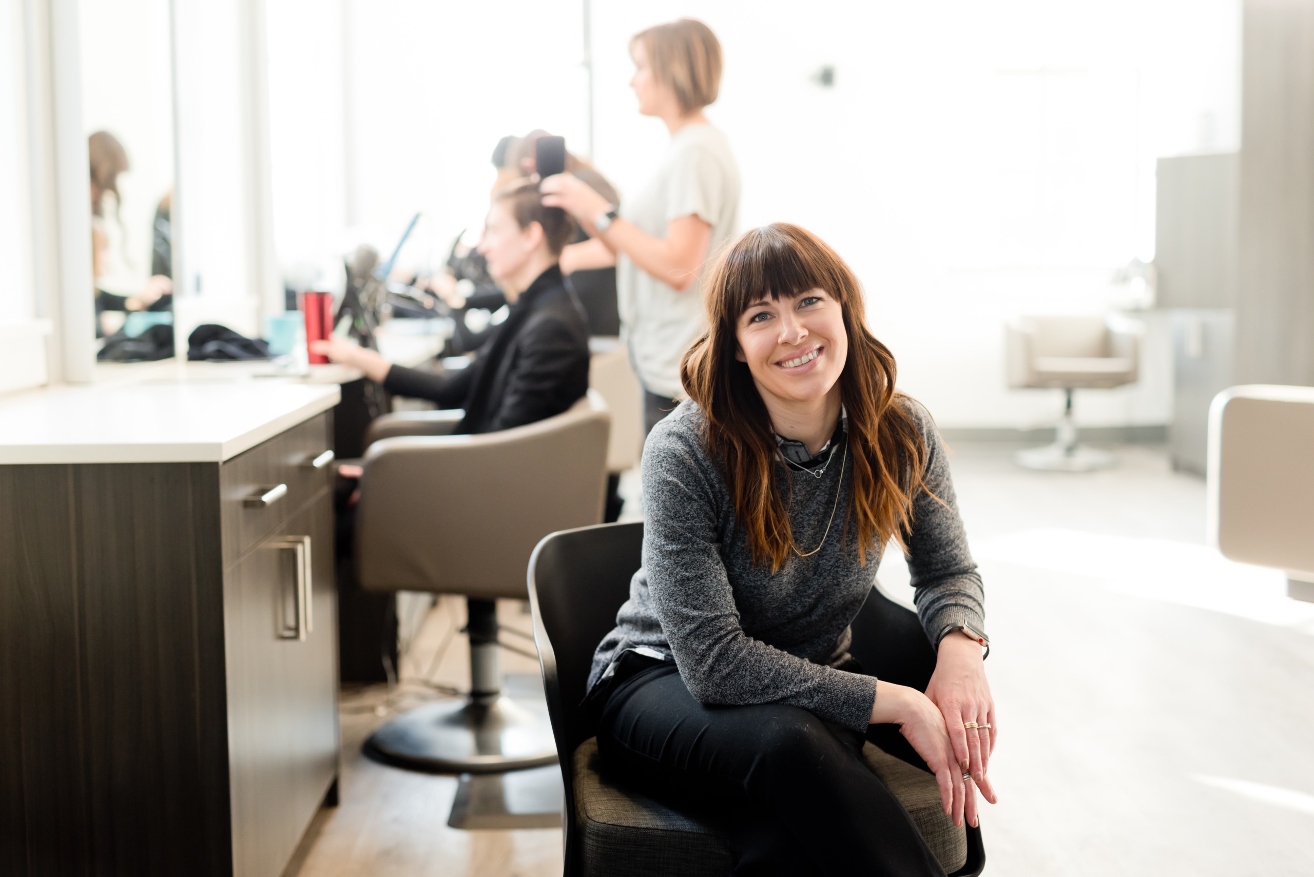 hair stylist in her chair