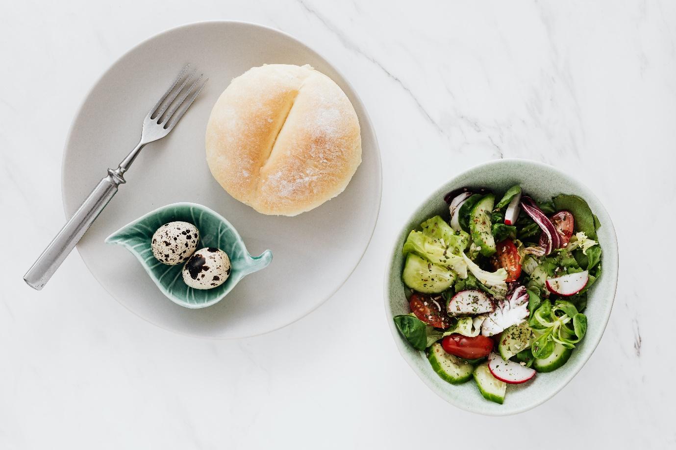 garden salad with bread and quails eggs