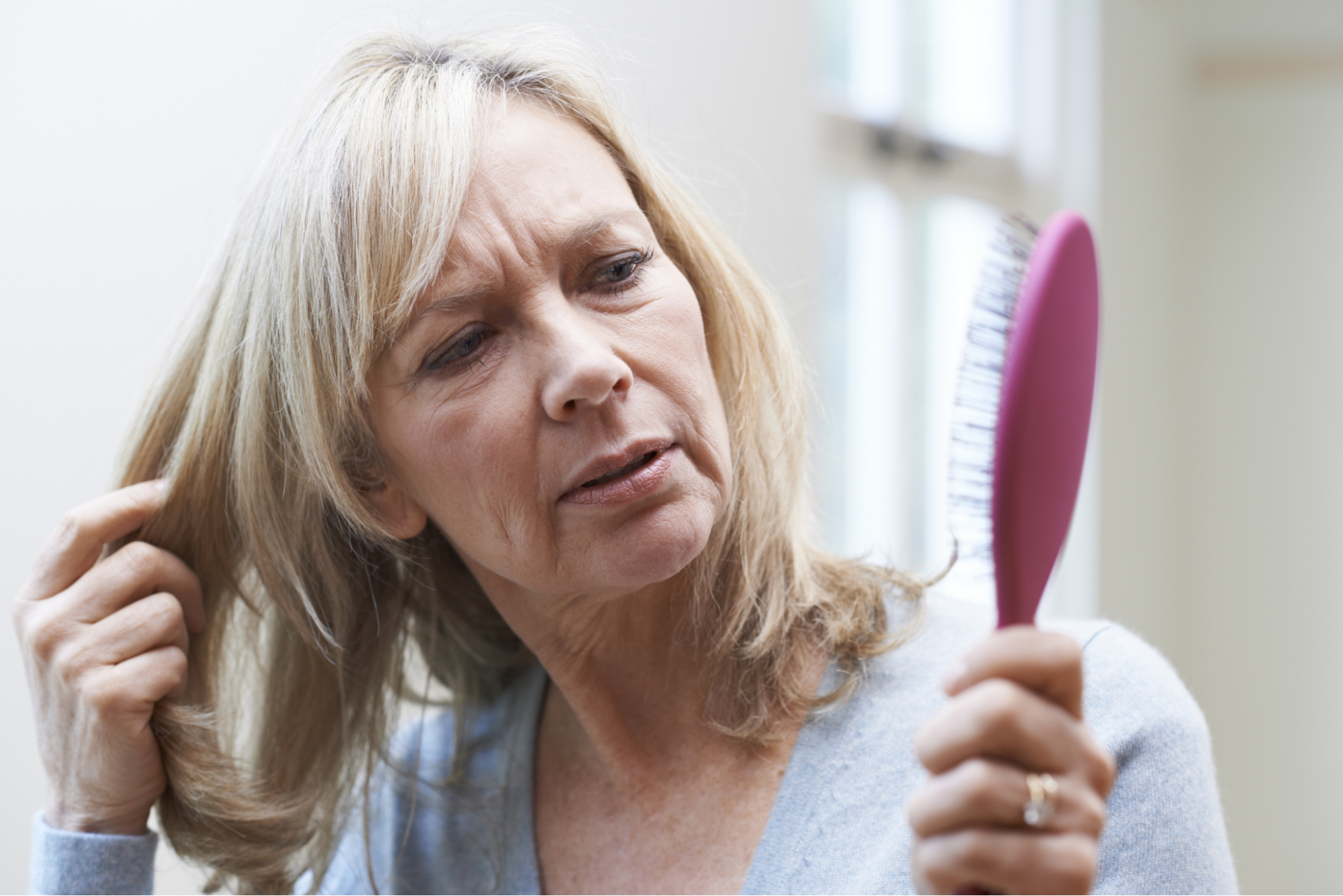 woman concerned about her hair loss