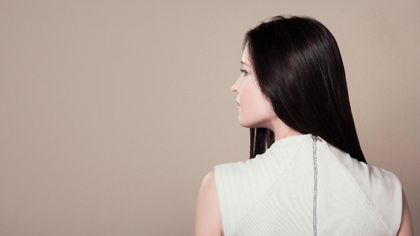 woman with long hair in white